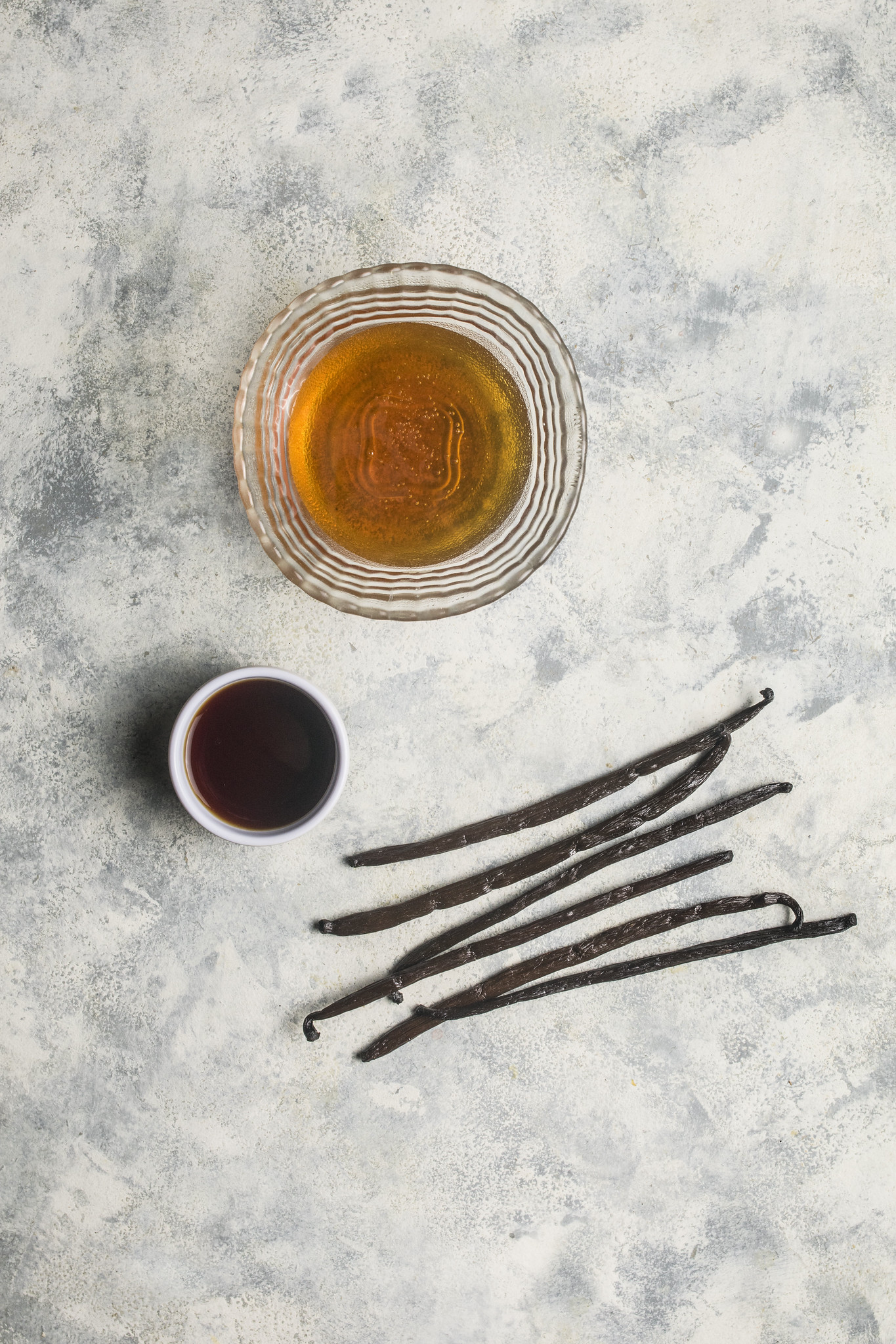 Vanilla beans, syrup and liquid ingredients for homemade vanilla bean paste